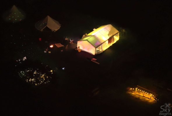 Petestock at night aerial view of illuminated event tents