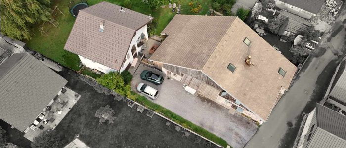 Aerial view of a house, highlighted in colour to display the boundary edges